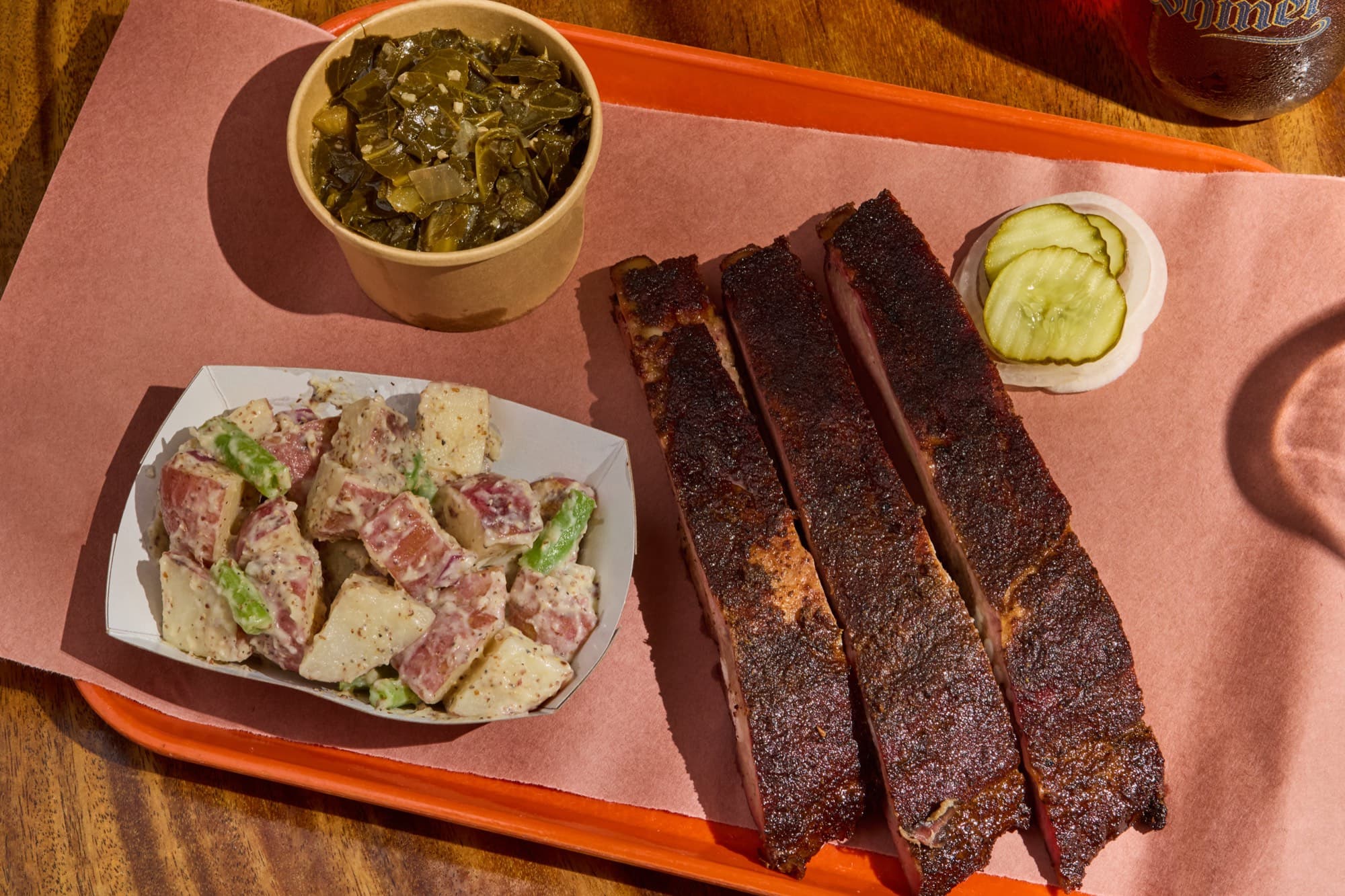 Smoked St. Louis ribs with collard greens and red-potato salad