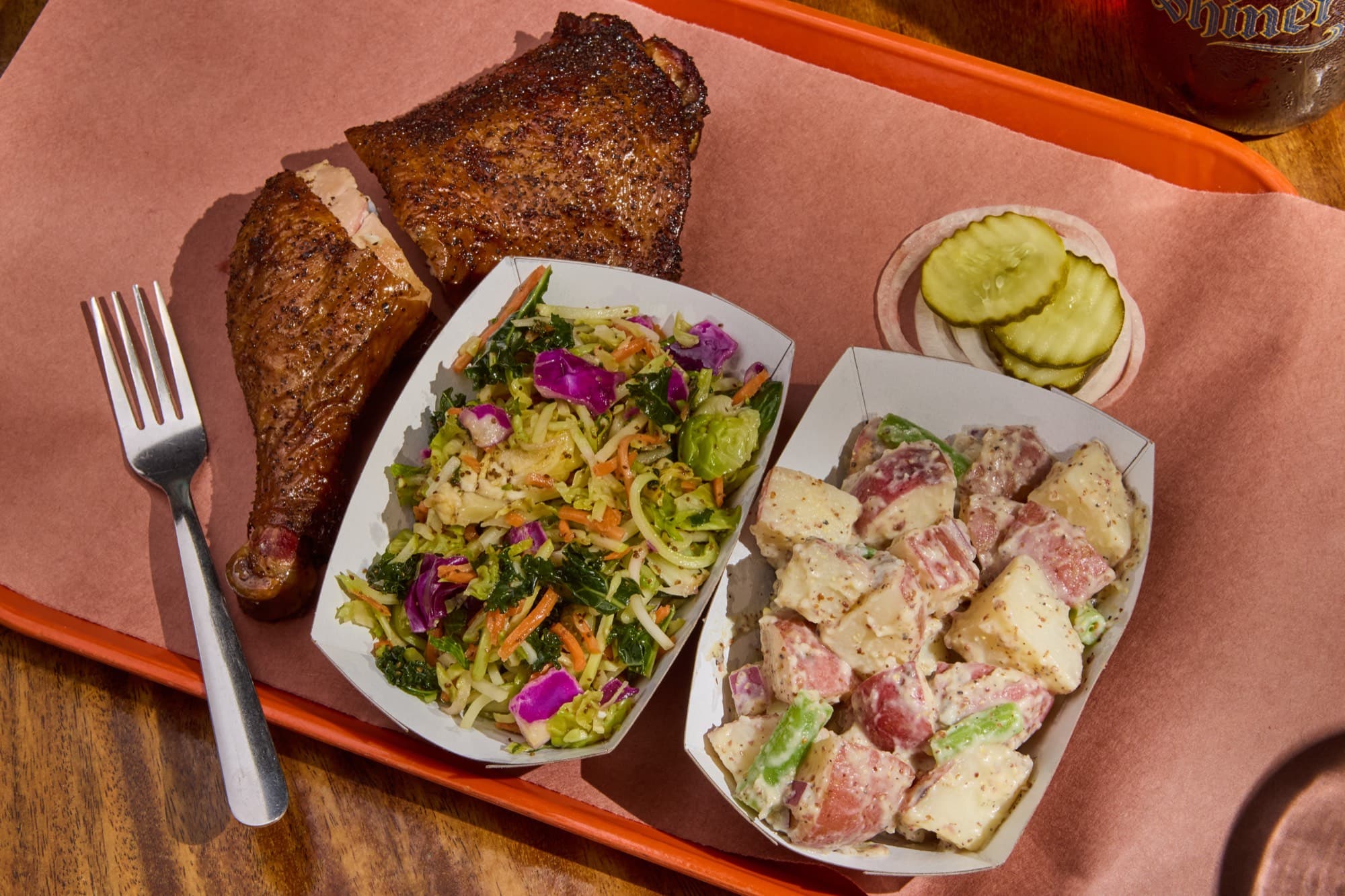Smoked chicken quarter with kale slaw and potato salad